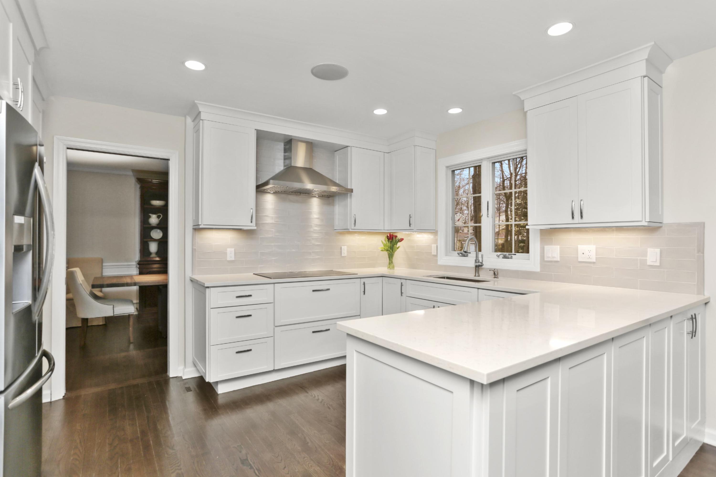 54 Country Club Road Darien, CT 06820 - Photo 12 of 40 a kitchen with a sink stove and cabinets