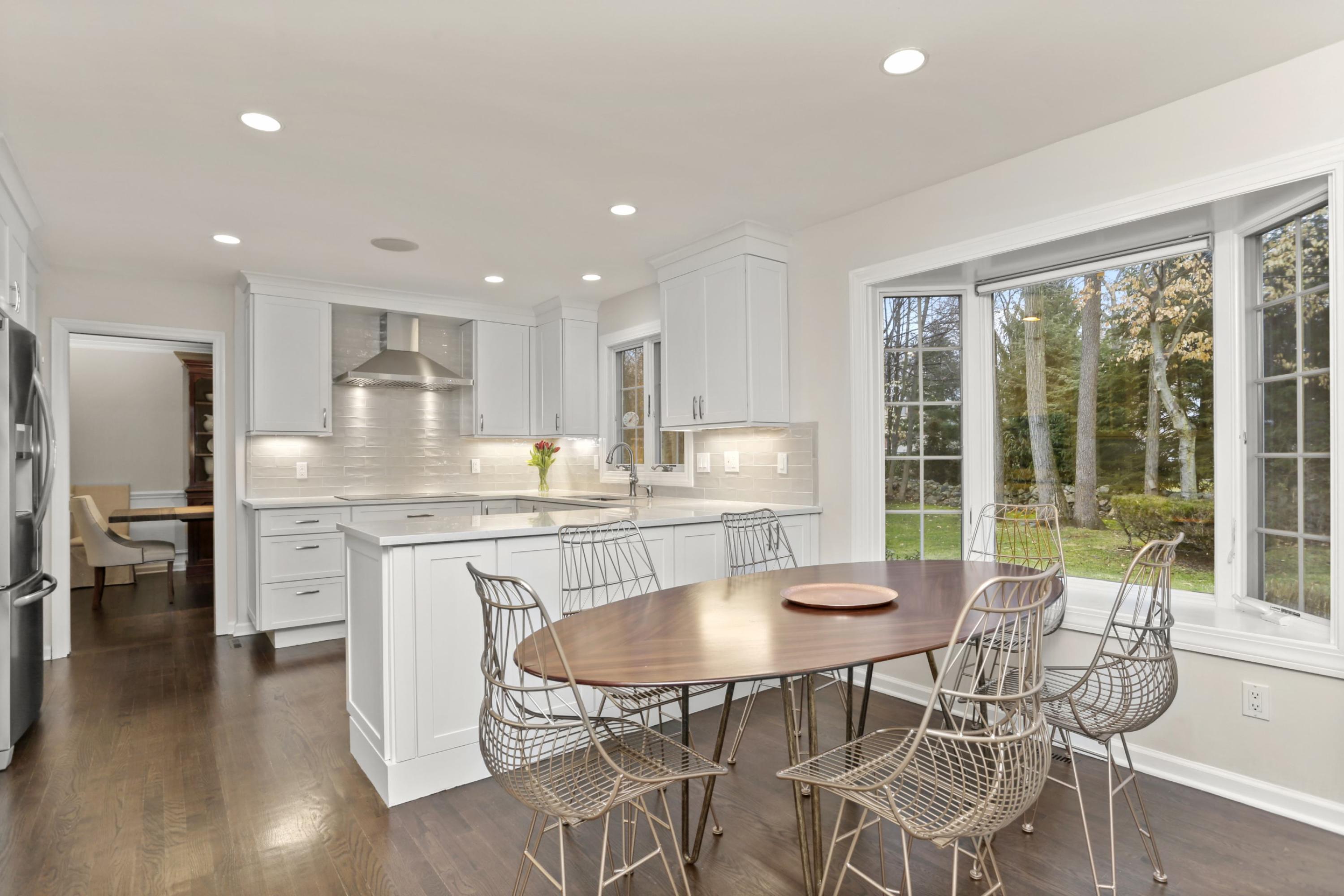 54 Country Club Road Darien, CT 06820 - Photo 13 of 40 a dining room with furniture a window and kitchen view