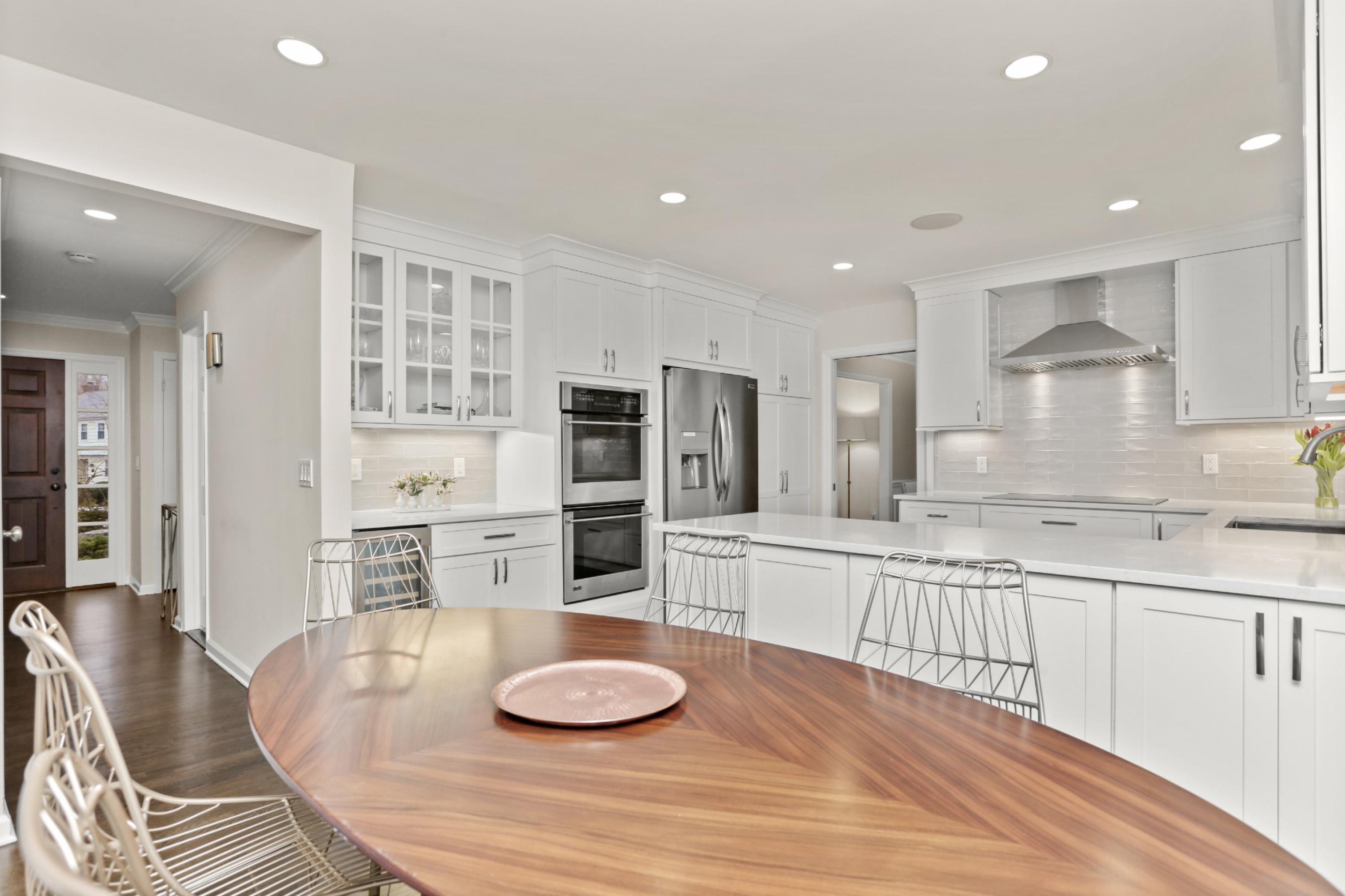 54 Country Club Road Darien, CT 06820 - Photo 14 of 40 a kitchen with stainless steel appliances granite countertop a sink and cabinets