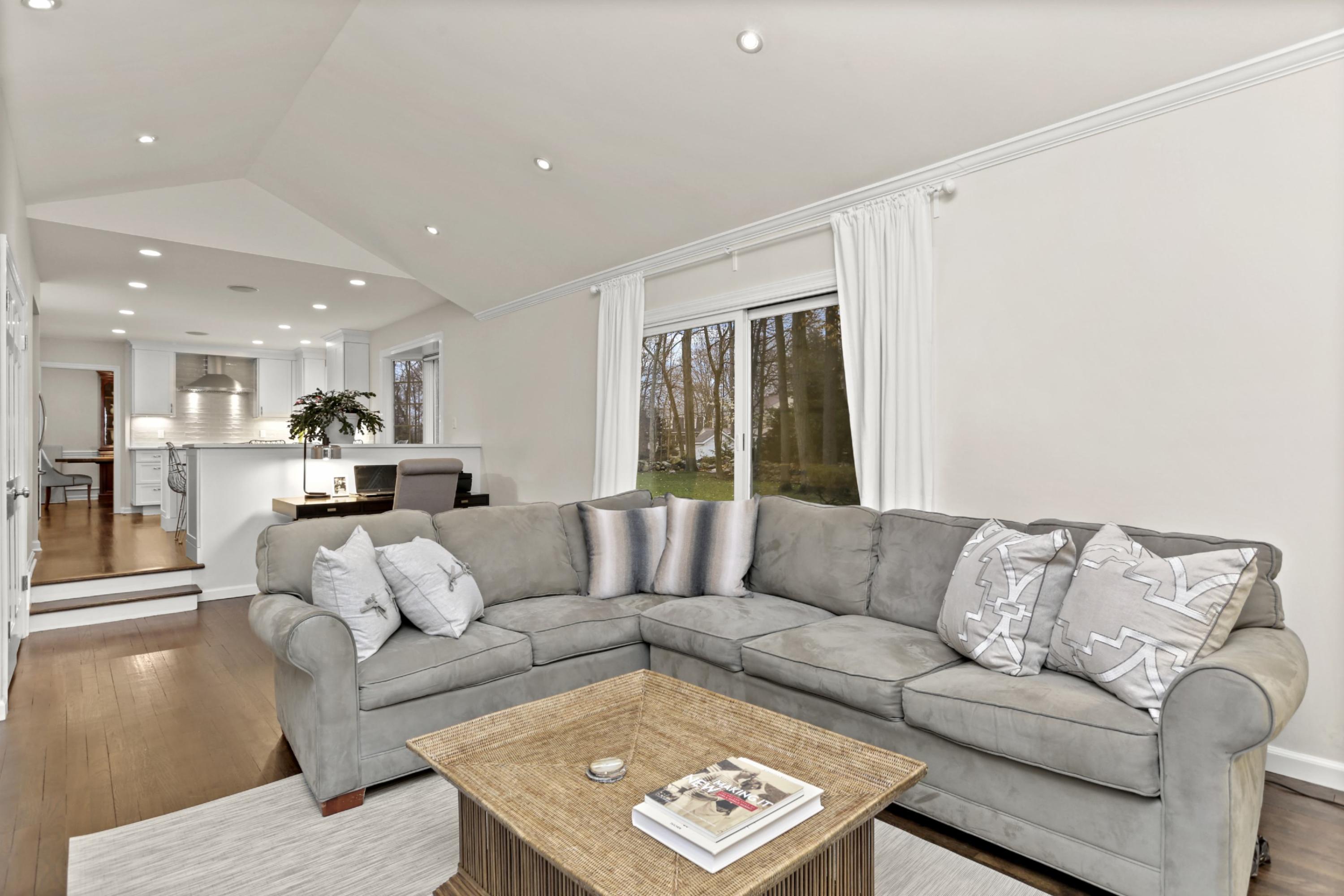 54 Country Club Road Darien, CT 06820 - Photo 17 of 40 a living room with furniture and a couch