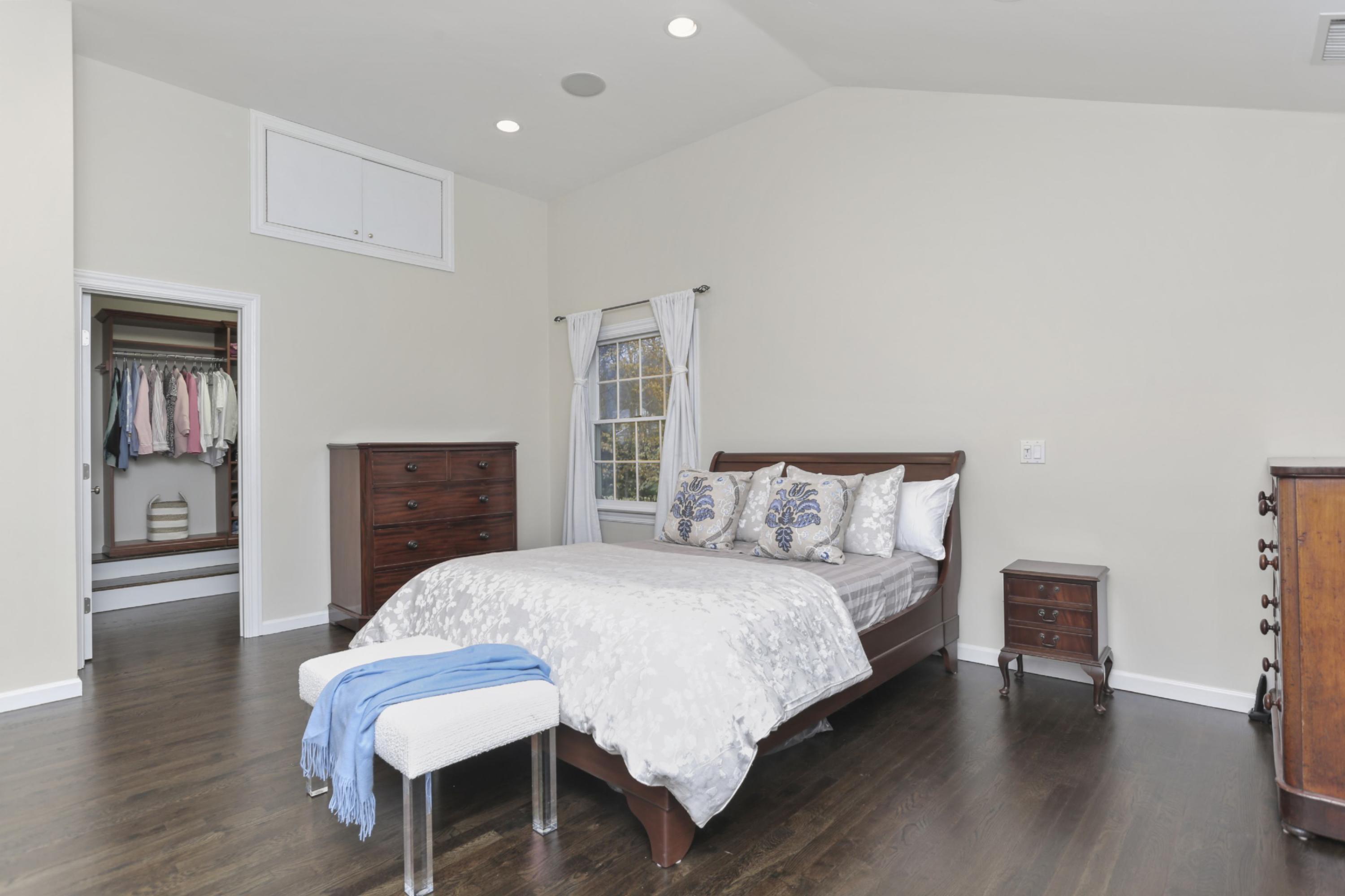 54 Country Club Road Darien, CT 06820 - Photo 20 of 40 a bedroom with a bed and a table