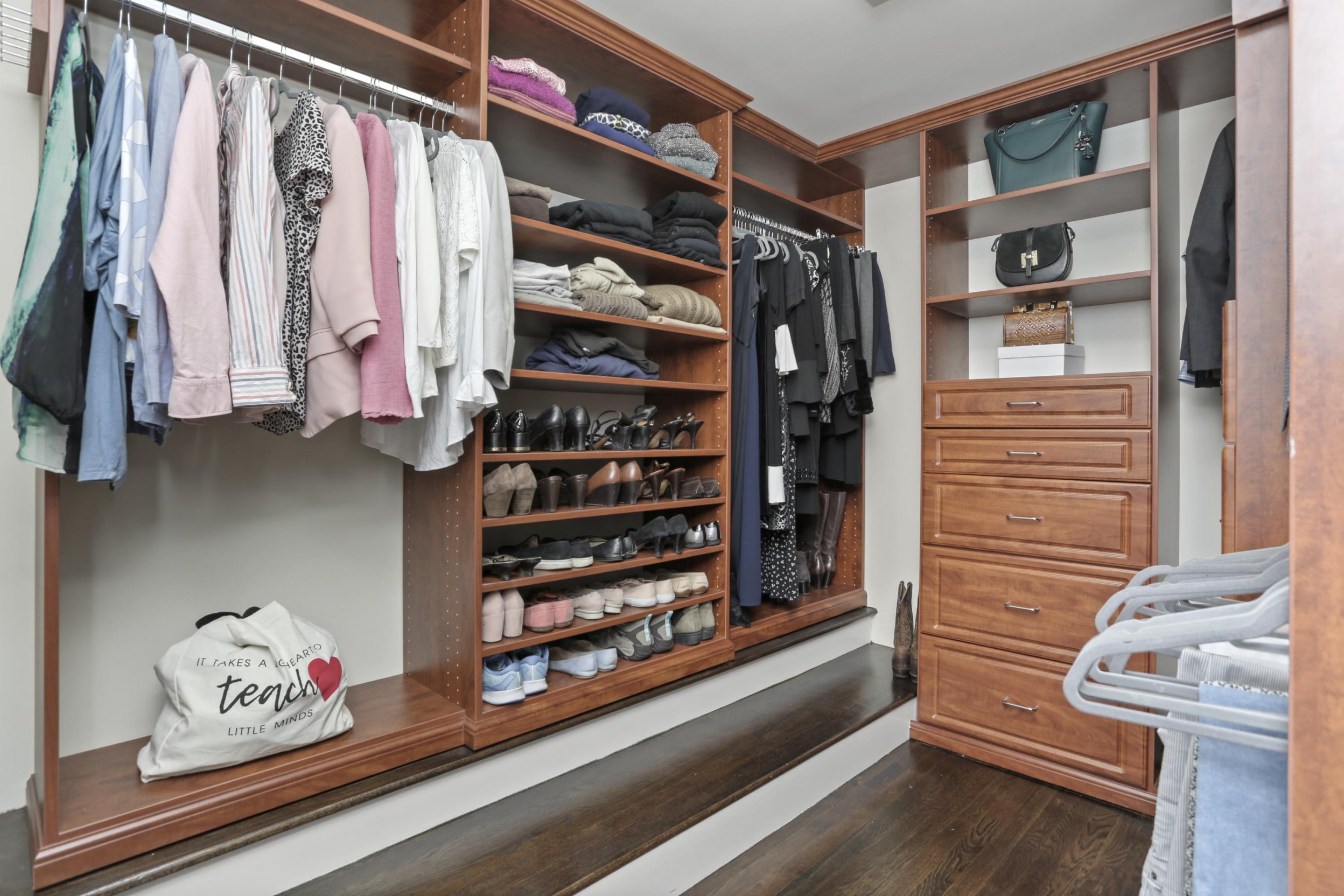 54 Country Club Road Darien, CT 06820 - Photo 21 of 40 a view of walk in closet with clothes and shoes