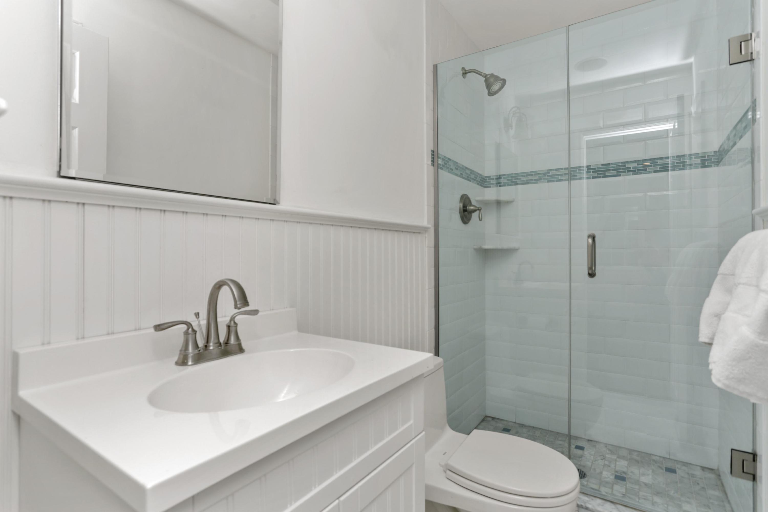 54 Country Club Road Darien, CT 06820 - Photo 26 of 40 a bathroom with a sink toilet and shower