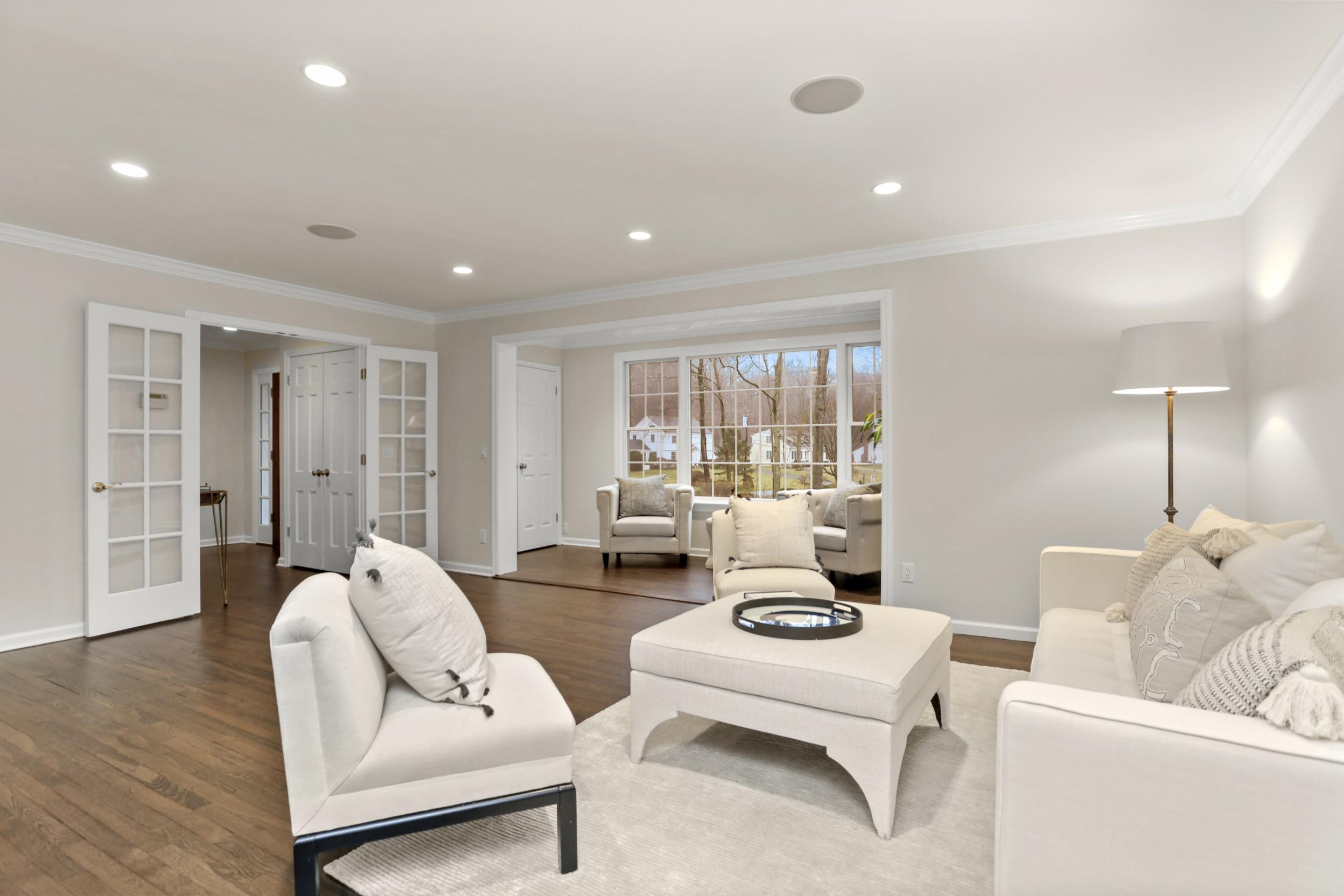 54 Country Club Road Darien, CT 06820 - Photo 8 of 40 a living room with furniture and wooden floor