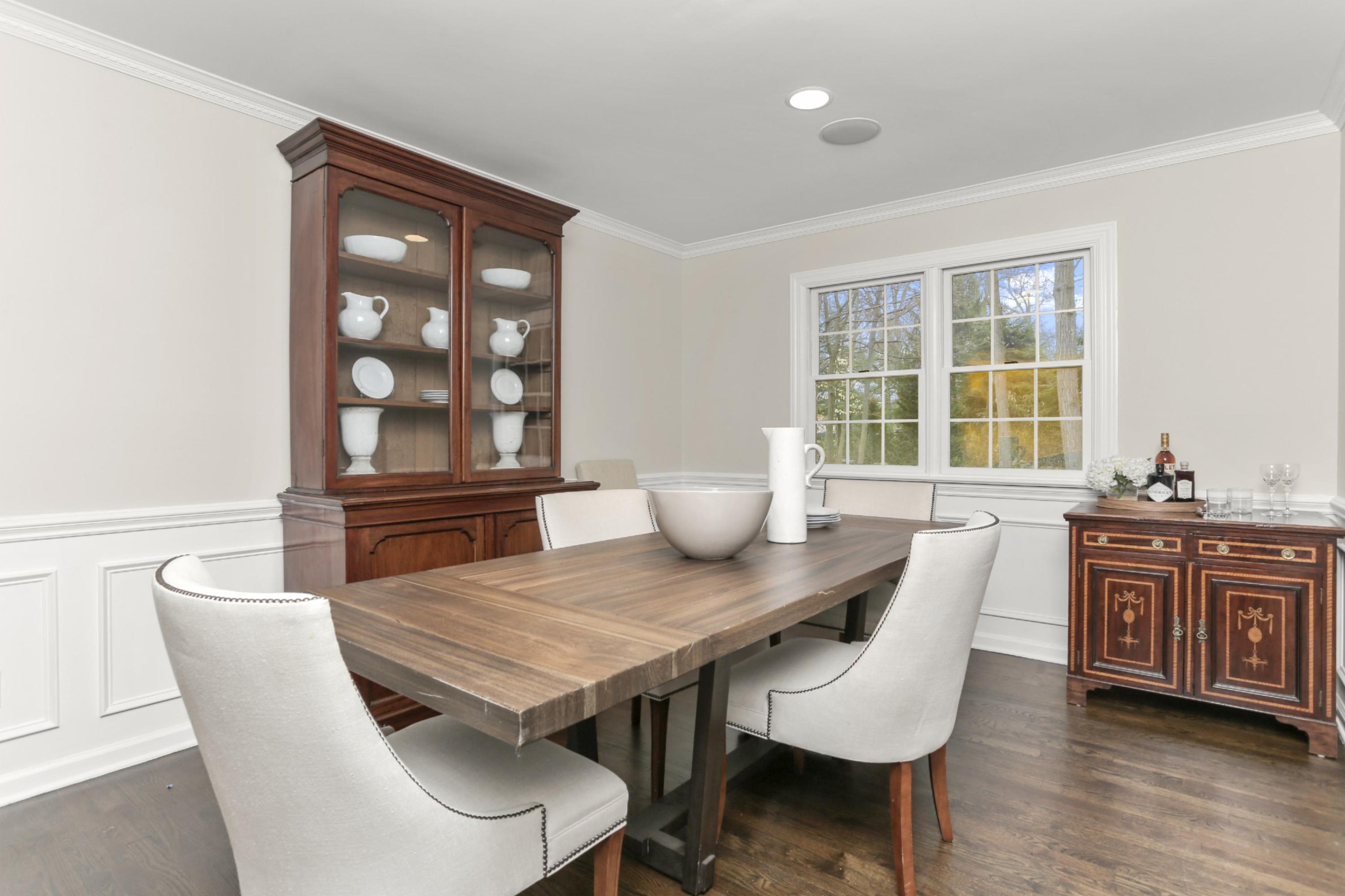 54 Country Club Road Darien, CT 06820 - Photo 9 of 40 a view of a dining room with furniture and wooden floor