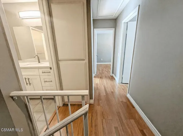 a view of a balcony with wooden floor