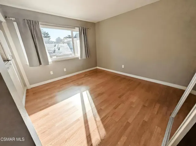 a view of an empty room and window