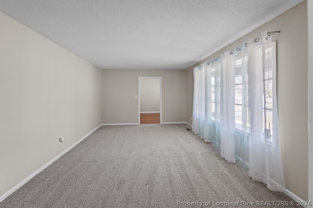 630 Bedford Road Fayetteville, NC 28303 - Photo 4 of 21 a view of an empty room with a window