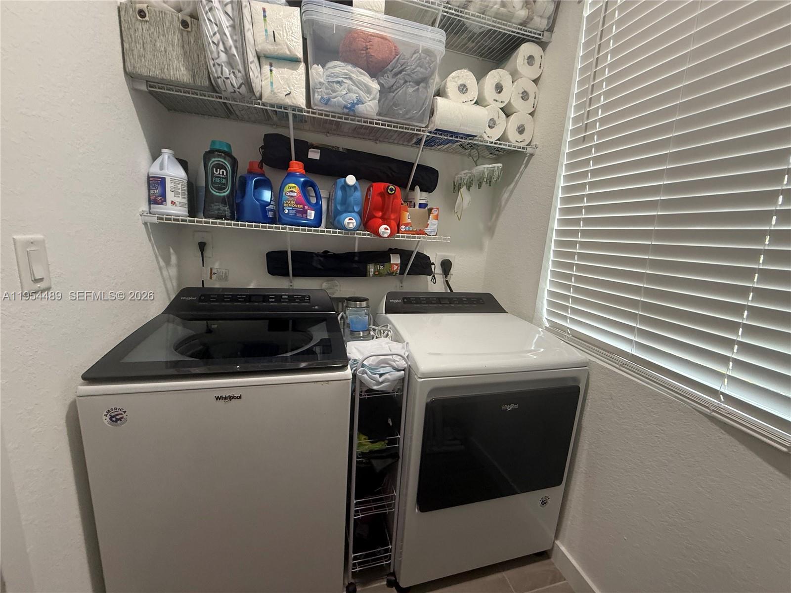 1043 Southeast 24th Avenue Homestead, FL 33035 - Photo 15 of 25 a utility room with dryer and washer
