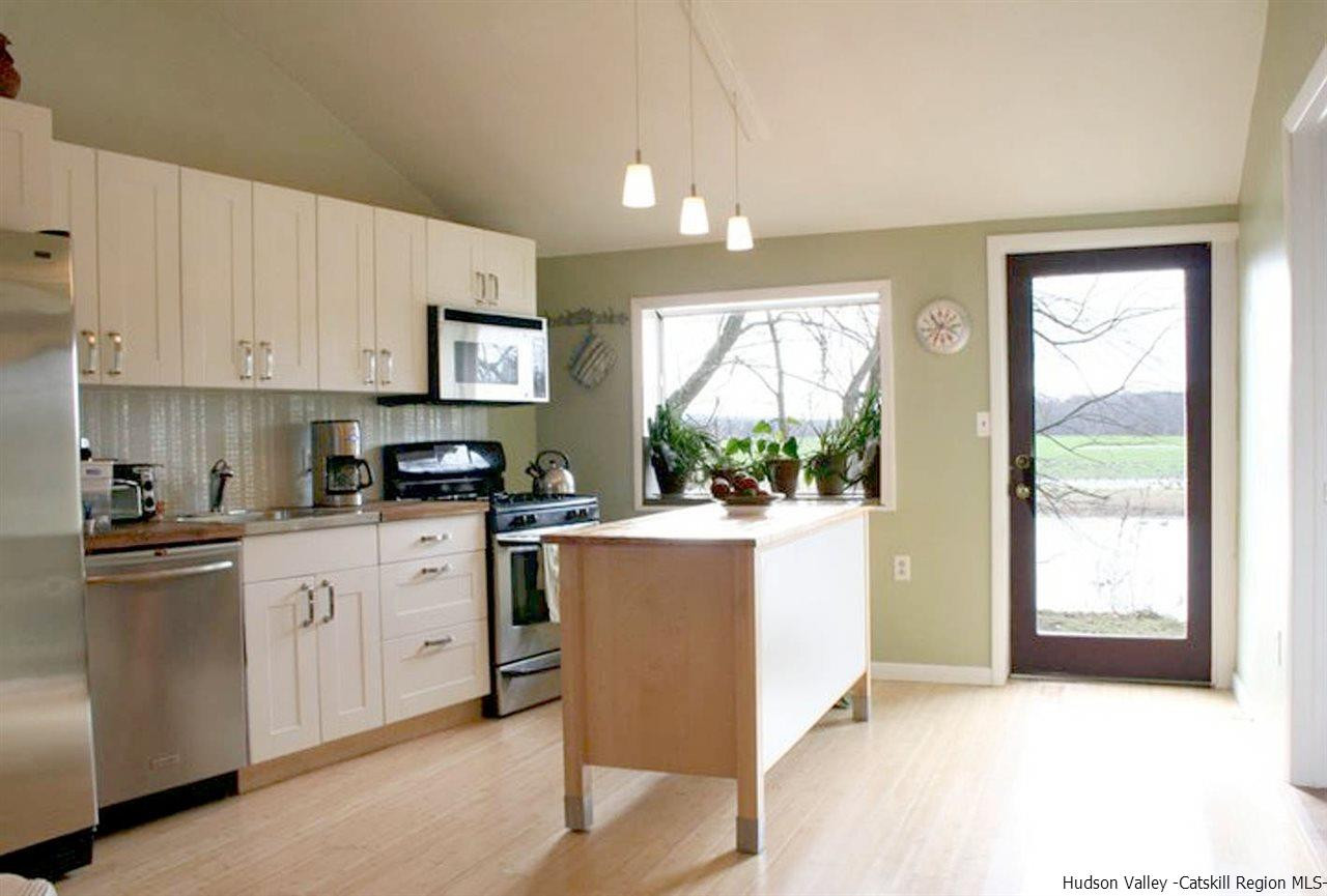 93 River Road New Paltz, NY 12561 - Photo 3 of 15 a kitchen with stainless steel appliances granite countertop a stove a sink dishwasher and a refrigerator