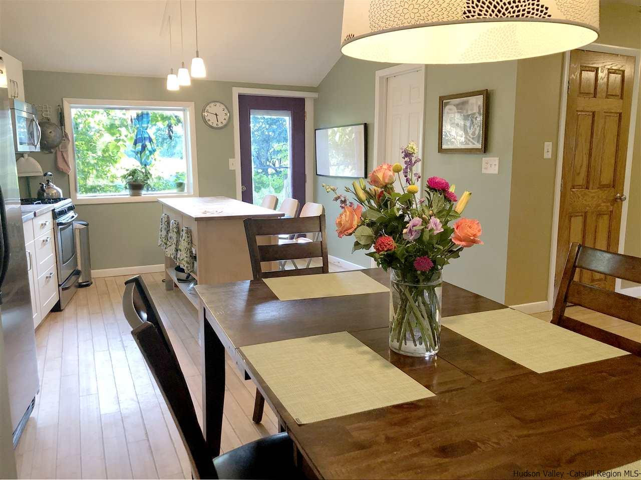 93 River Road New Paltz, NY 12561 - Photo 4 of 15 a living room with furniture and a chandelier