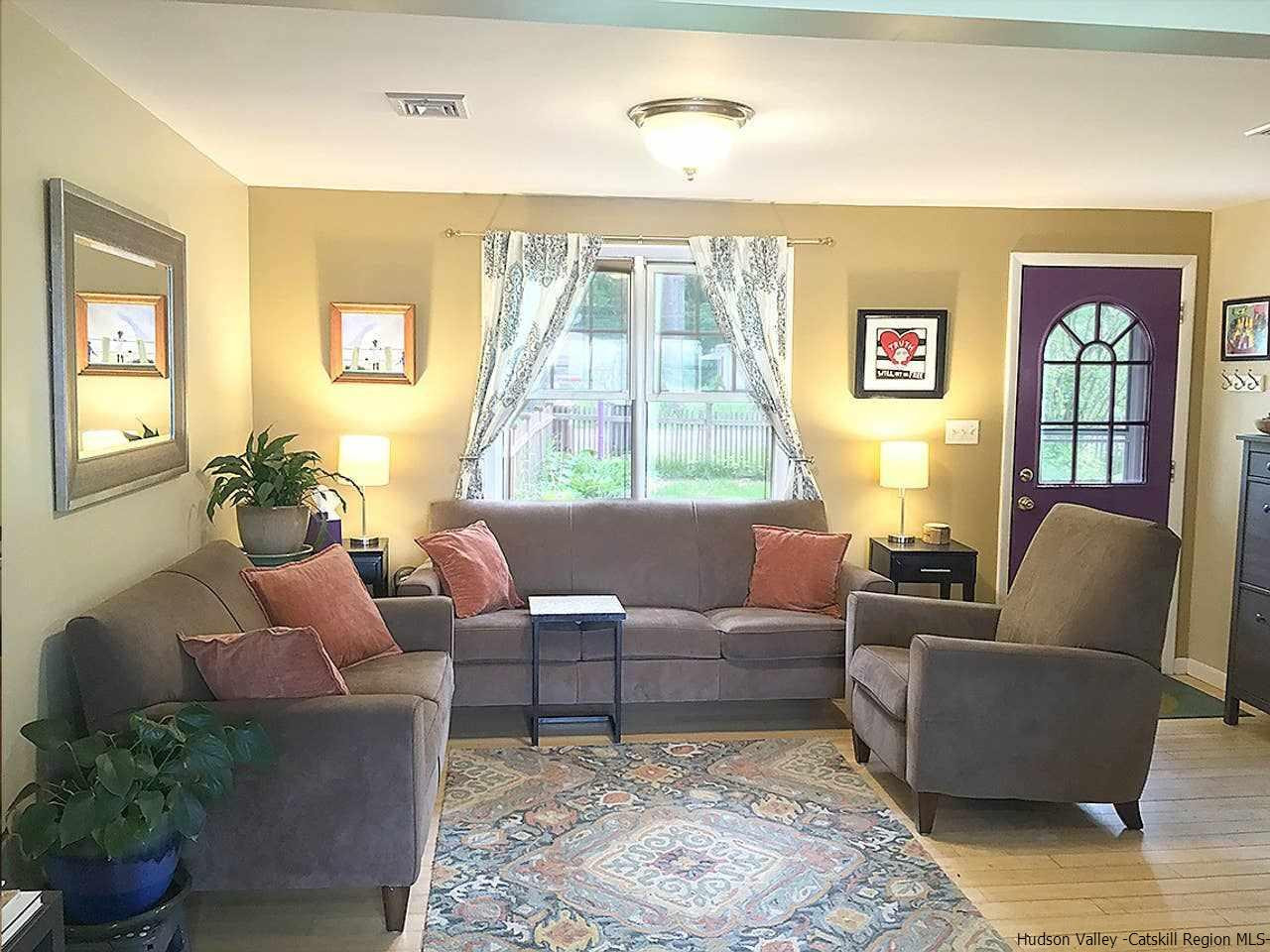 93 River Road New Paltz, NY 12561 - Photo 8 of 15 a living room with furniture and a large window