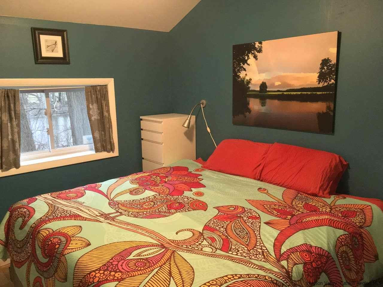 93 River Road New Paltz, NY 12561 - Photo 9 of 15 a bedroom with a bed and a window