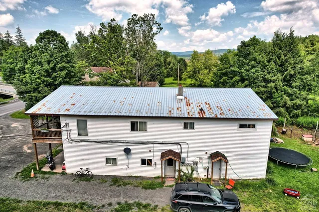 a view of a back yard of the house
