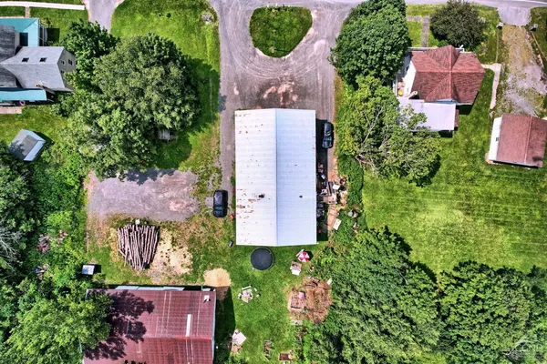 an aerial view of house with yard swimming pool and outdoor seating