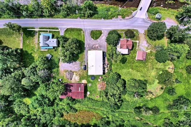 an aerial view of a house with a garden