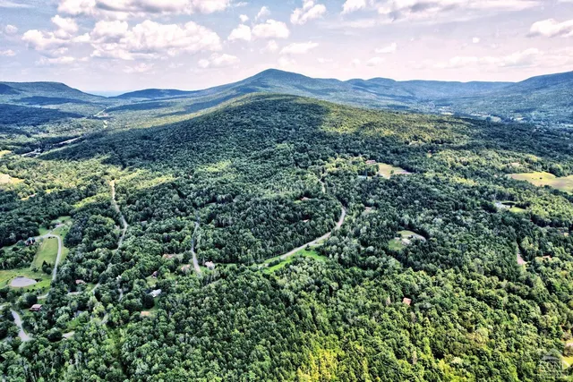 a view of a houses with a yard