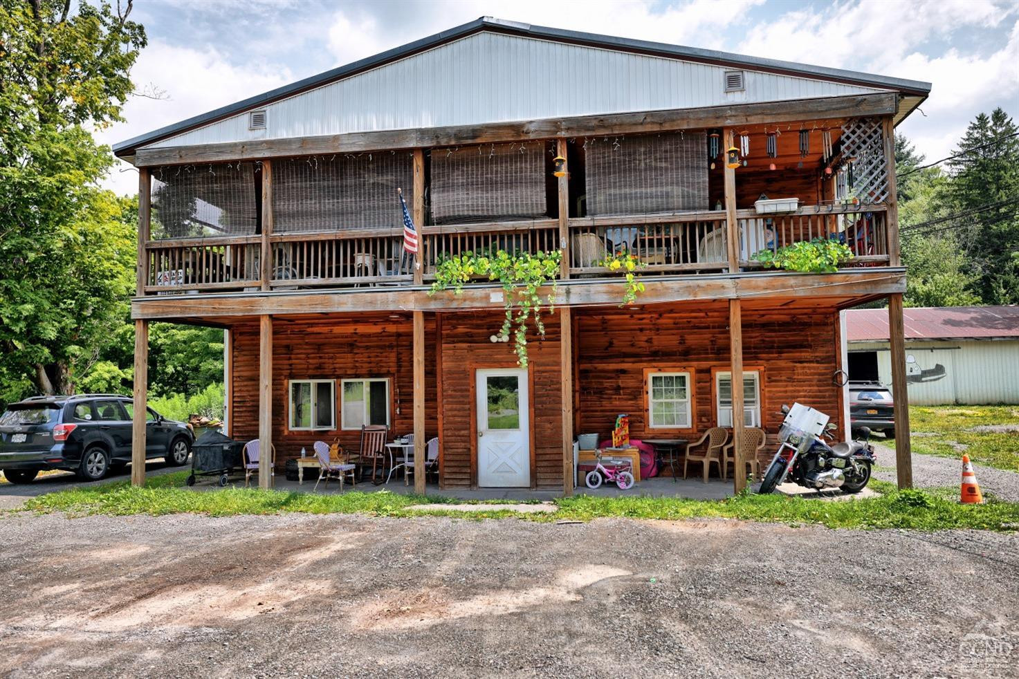 41 County Road 40 Windham, NY 12439 - Photo 27 of 36 a view of a house with a porch and furniture