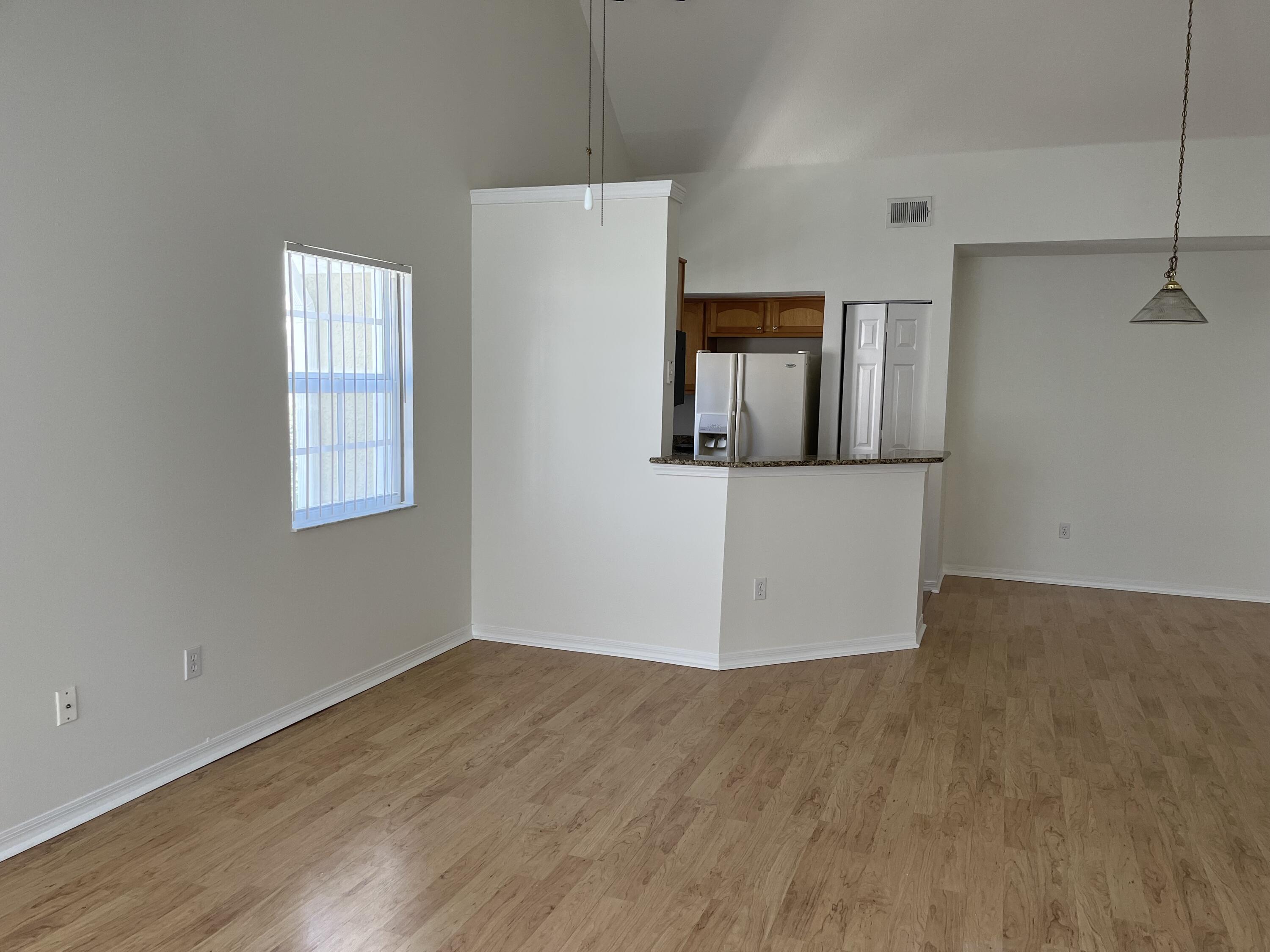 1621 Southeast Pomeroy Street, Unit 56 Stuart, FL 34997 - Photo 4 of 8 View of dining room and kitchen from liv
