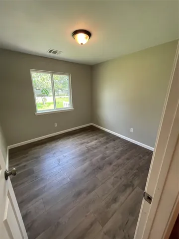 a bathroom with a toilet a sink and bathtub