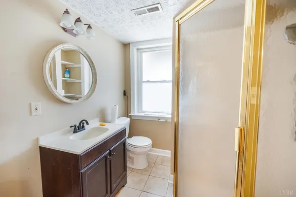 an aerial view of a backyard with outdoor seating