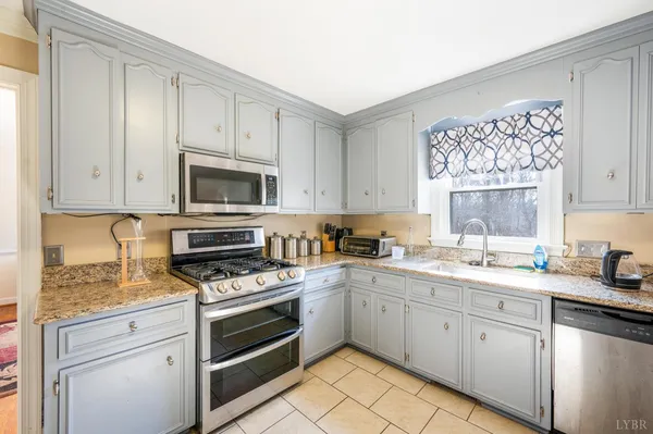 a view of a dining area with furniture window and wooden floor