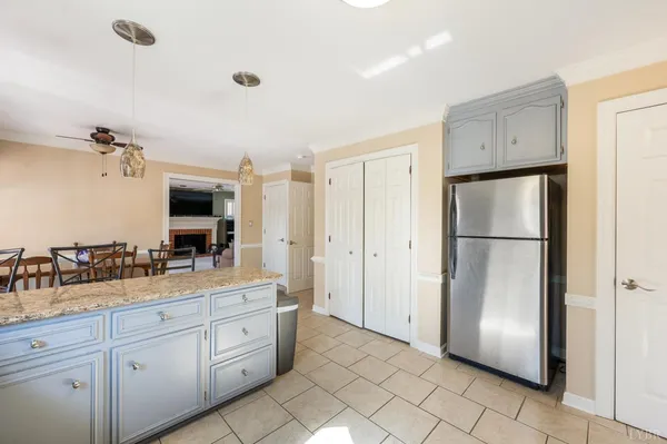 a bedroom with furniture and a large window