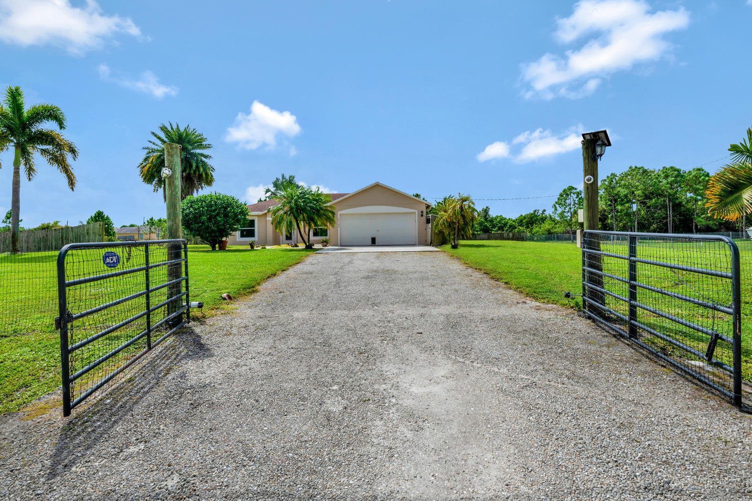 16182 93rd Road North The Acreage, FL 33470 - Photo 1 of 21 Front