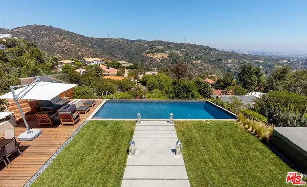 a view of swimming pool with a garden