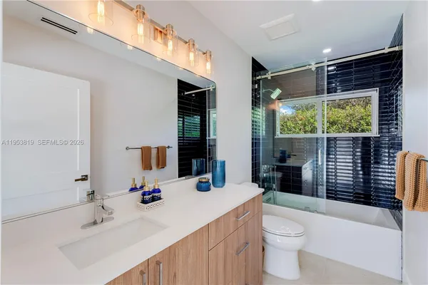 a swimming pool with outdoor seating and yard