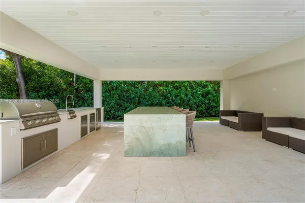 a view of a patio with table and chairs