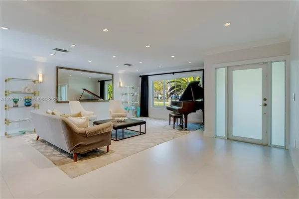 a living room with furniture and a lamp