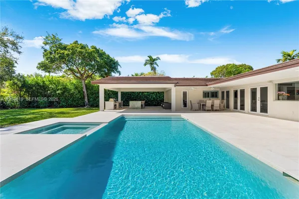 a view of a backyard with a patio