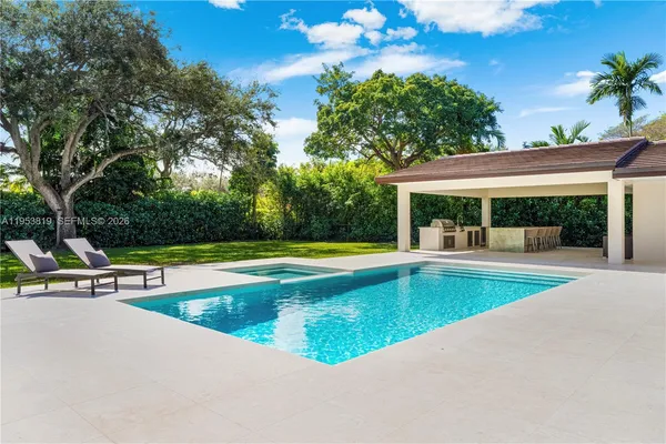 a view of house with yard outdoor seating and entertaining space