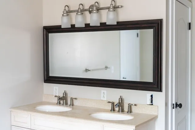 a kitchen with stainless steel appliances a stove microwave and a refrigerator