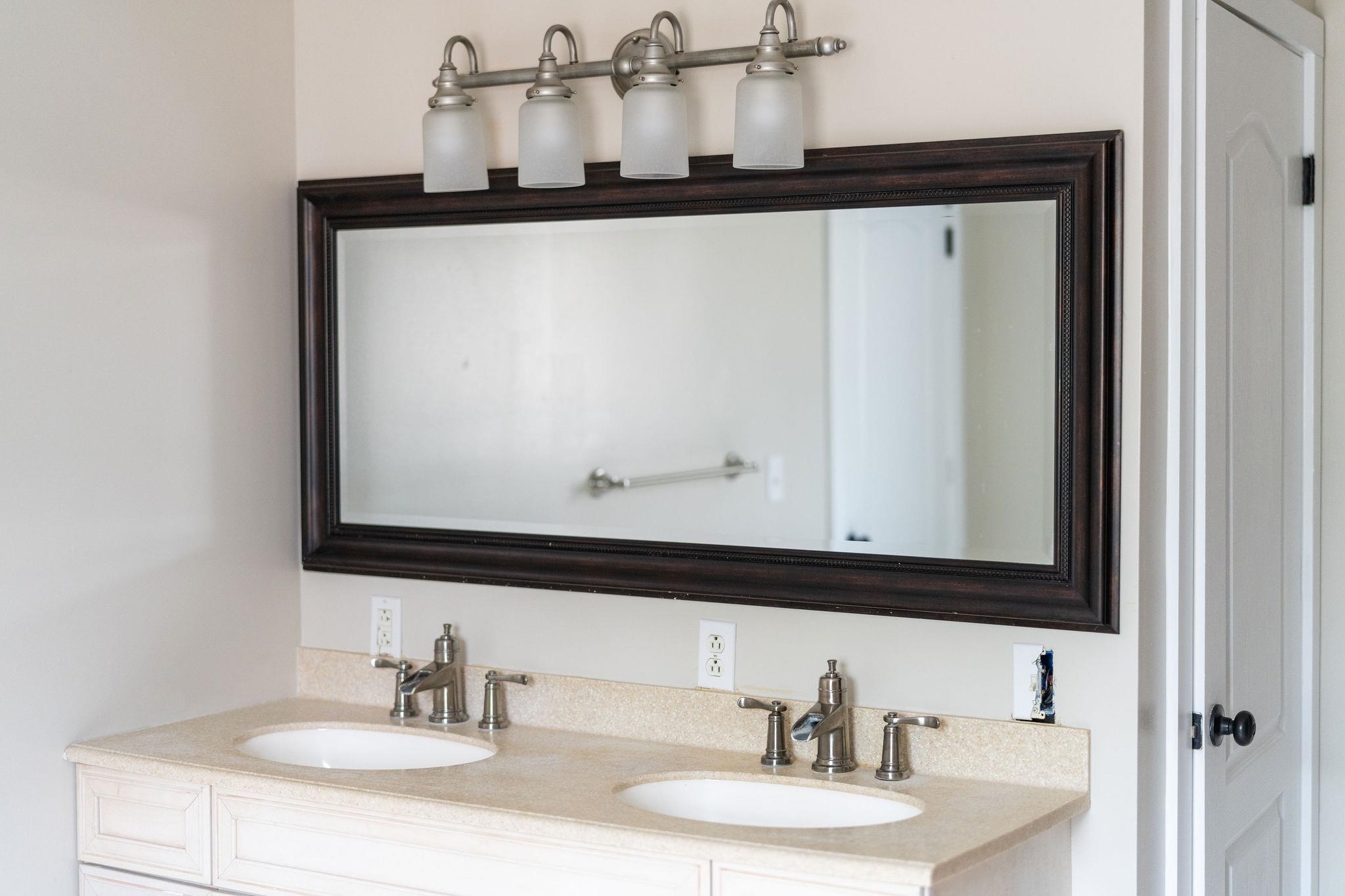 198 Turk Mountain Lane Waynesboro, VA 22980 - Photo 44 of 58 a bathroom with a sink and a mirror