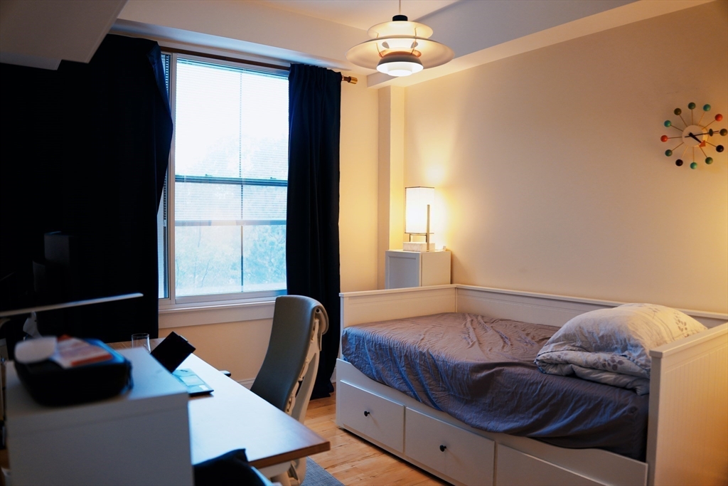 110 Cypress Street, Unit 307 Brookline, MA 02445 - Photo 13 of 24 a bedroom with a bed and a window