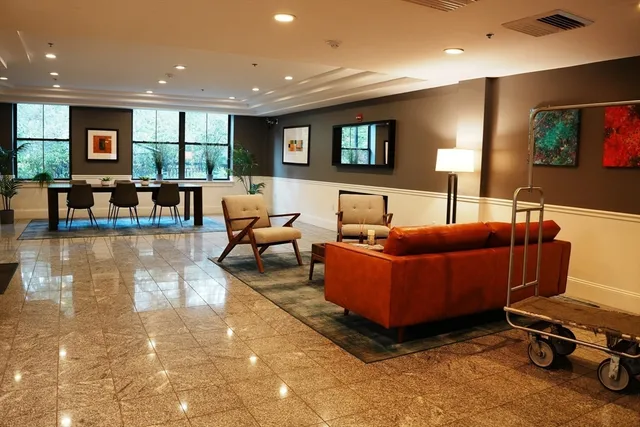 a living room with furniture and a table