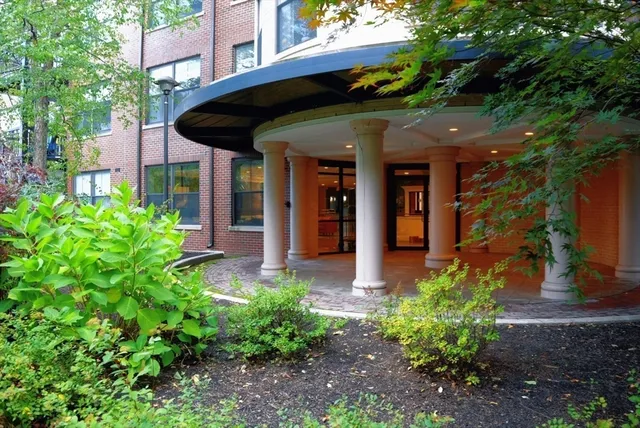 a view of a pathway along the building