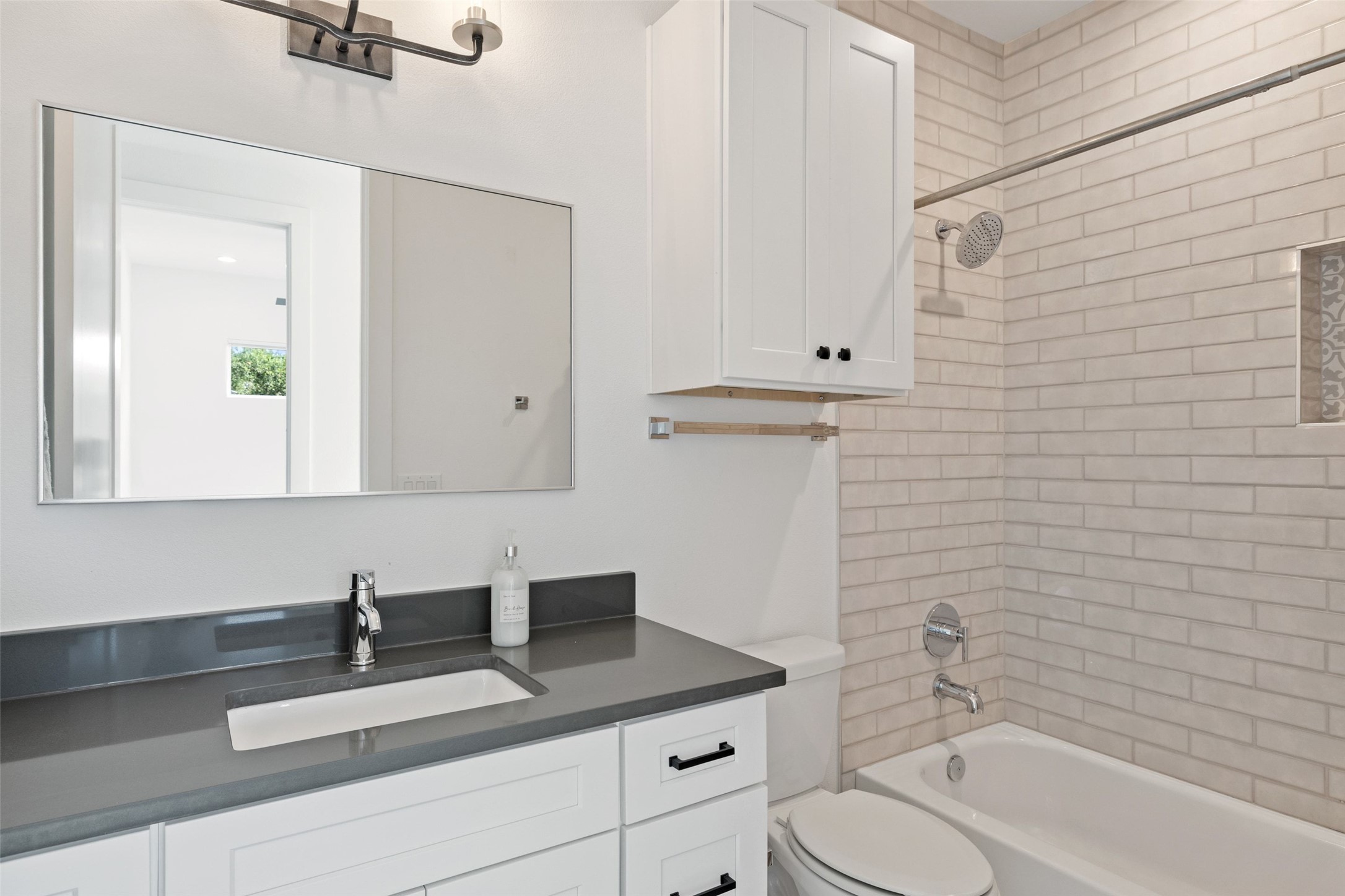 5601 Jackie Robinson Street, Unit 1 Austin, TX 78721 - Photo 27 of 40 A beautifully appointed full bath.