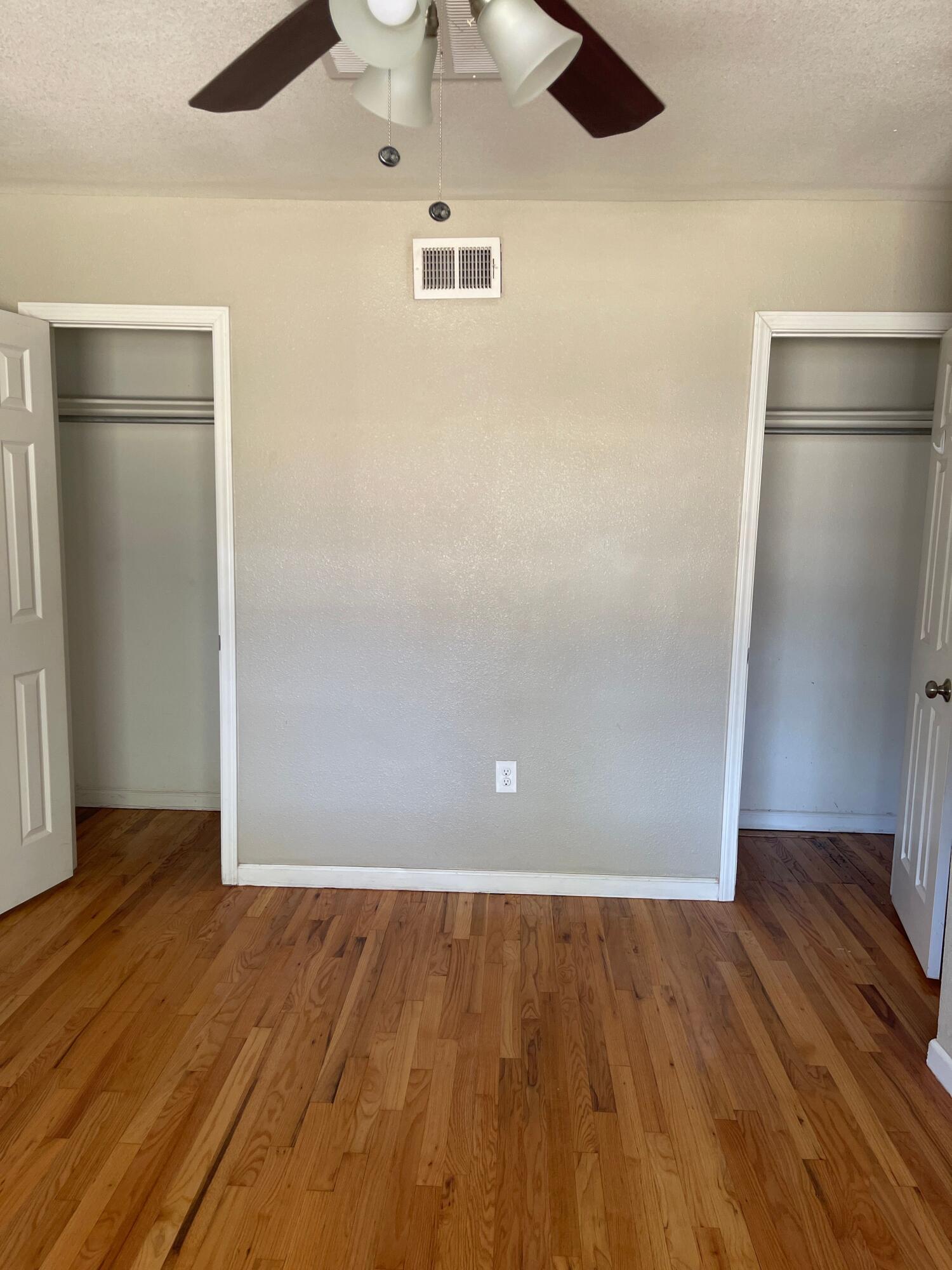 3011 32nd Street Lubbock, TX 79410 - Photo 13 of 16 an empty room with wooden floor