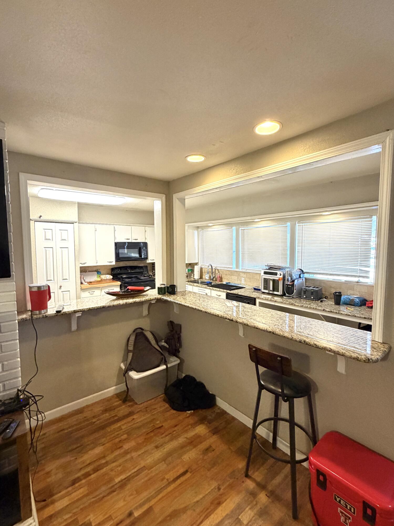 3011 32nd Street Lubbock, TX 79410 - Photo 6 of 16 a kitchen with a sink appliances and cabinets