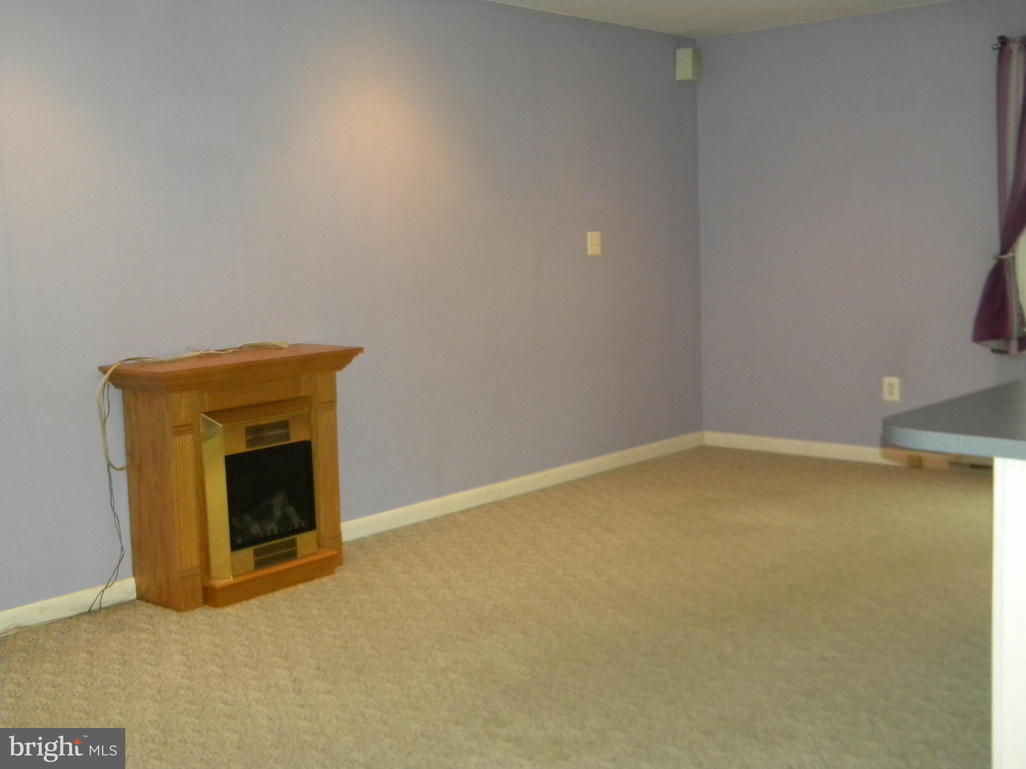 4520 Church Road Hampstead, MD 21074 - Photo 12 of 28 In Law Apt Family Room w/Electric Fireplace