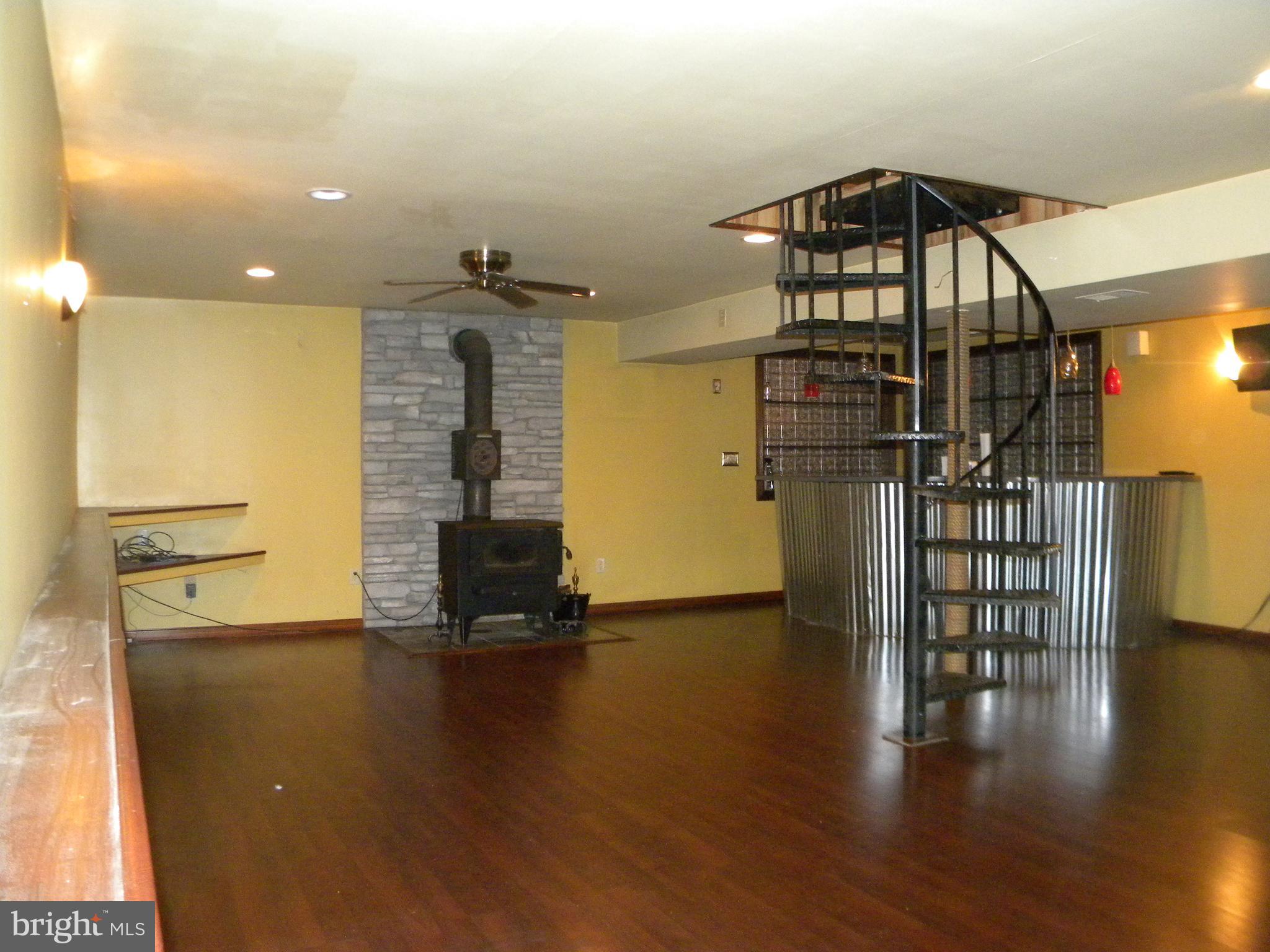 4520 Church Road Hampstead, MD 21074 - Photo 5 of 28 Lower Level w/Wood Stove