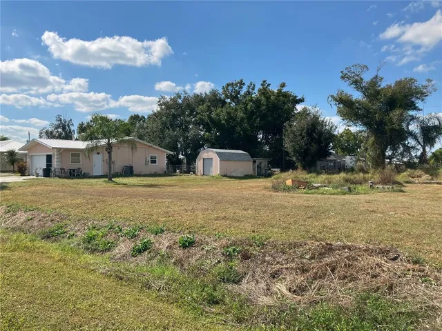 a house view with swimming pool in front of it