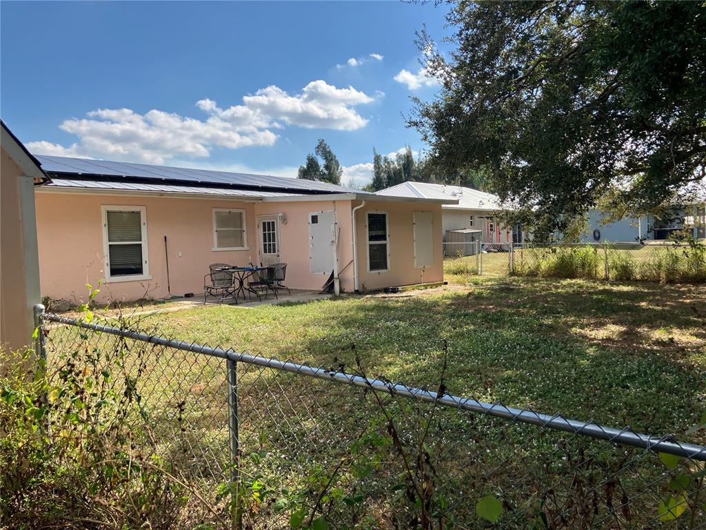 11337 Southwest Pine Avenue Arcadia, FL 34269 - Photo 8 of 8 a front view of a house with garden