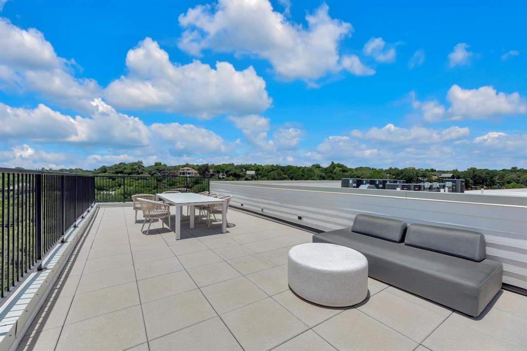 2500 Longview Street, Unit 418 Austin, TX 78705 - Photo 29 of 40 Rooftop balcony featuring outdoor dining space and a view of skyline