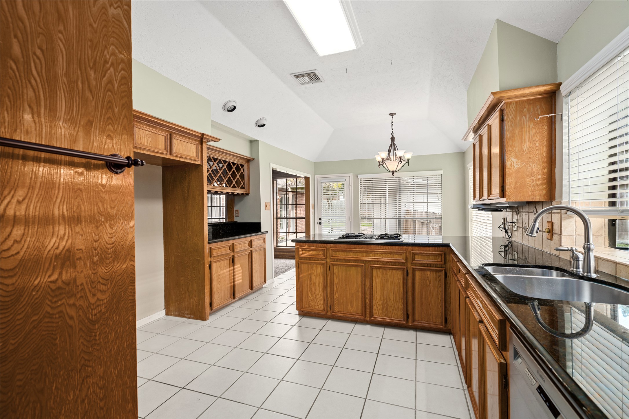 16106 Ridge Park Drive Houston, TX 77095 - Photo 11 of 23 a kitchen with stainless steel appliances granite countertop a sink stove and refrigerator