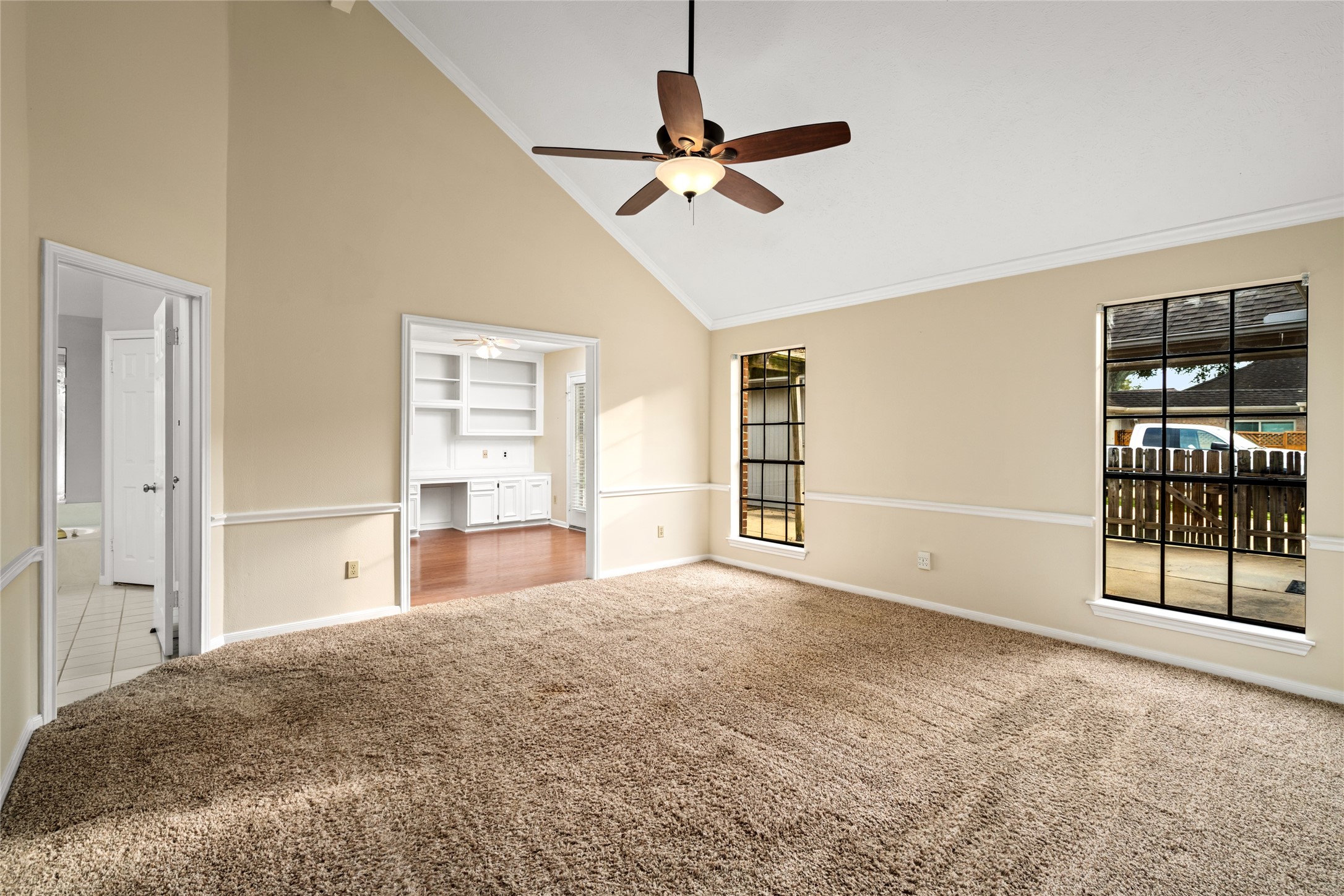 16106 Ridge Park Drive Houston, TX 77095 - Photo 16 of 23 a view of a livingroom with a ceiling fan and windows