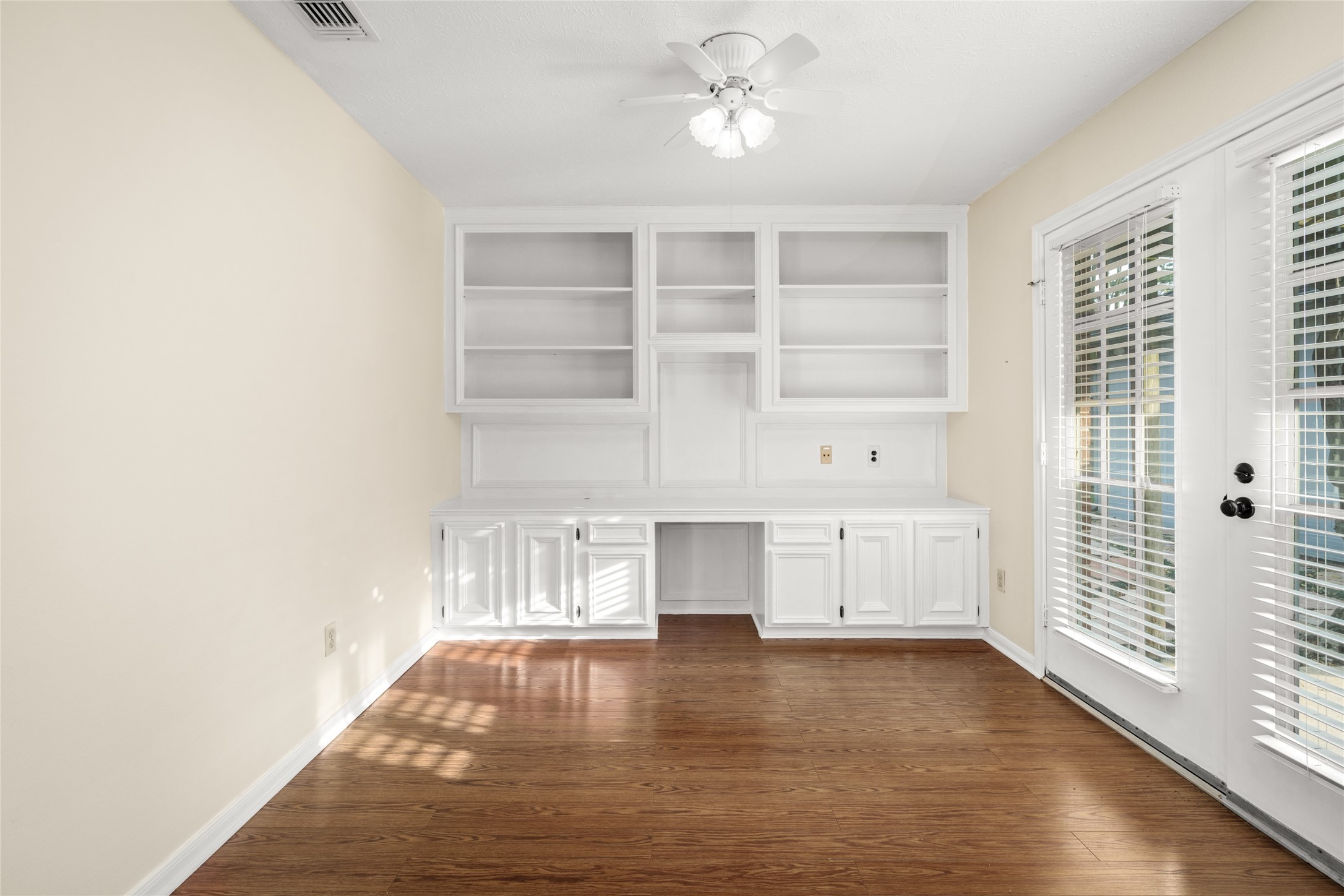 16106 Ridge Park Drive Houston, TX 77095 - Photo 17 of 23 a view of an empty room with a window and wooden floor